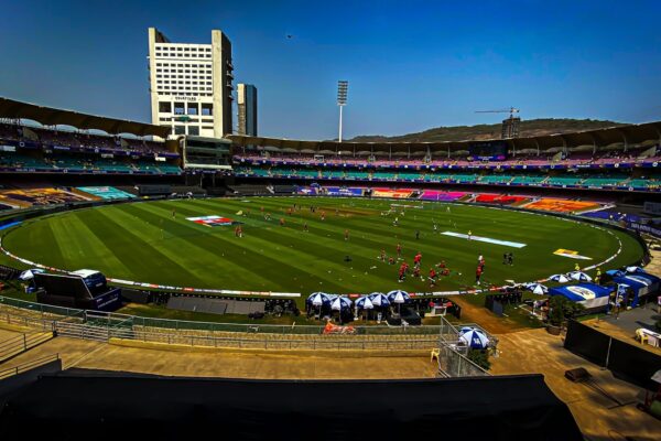 a sports field with a crowd of people in the stands